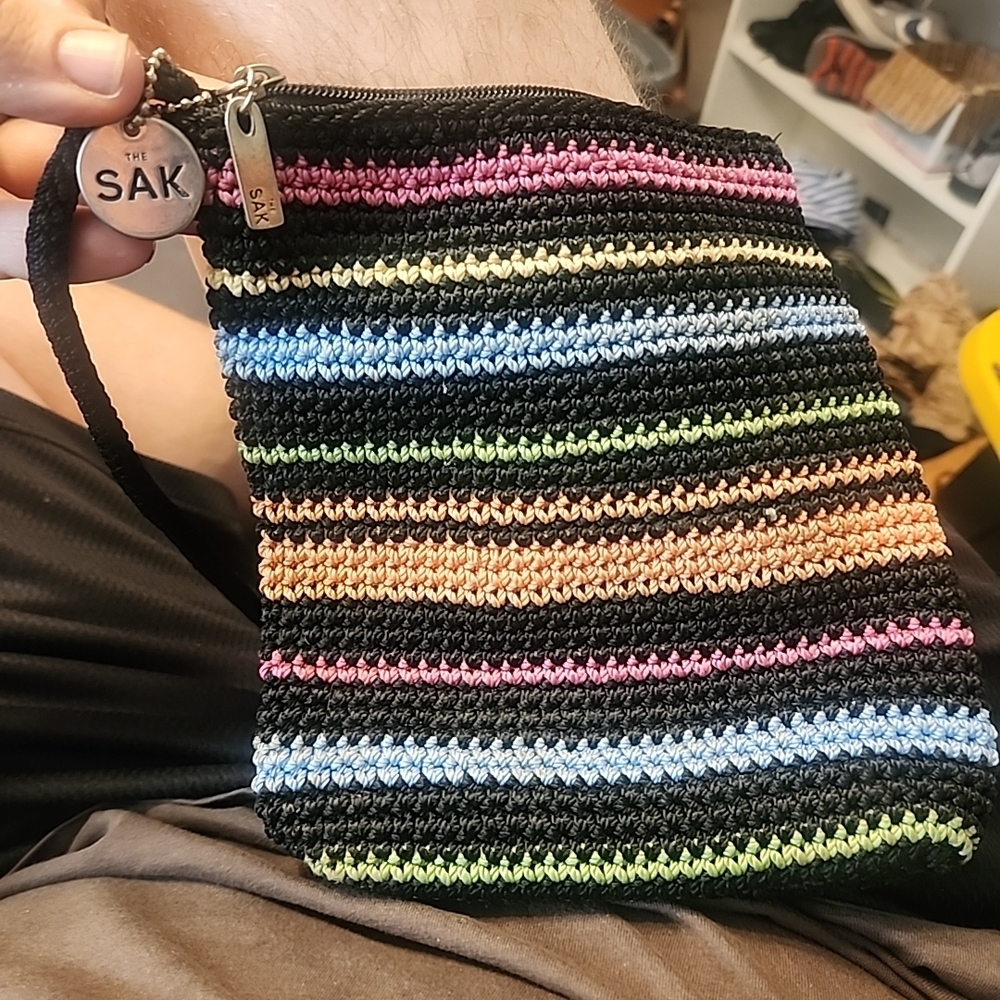 The Sak Black Crochet Wristlet with Pastel Stripes
